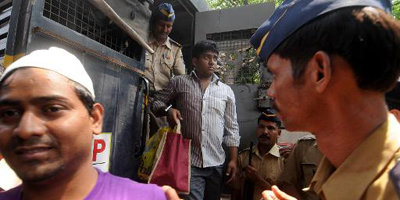 Indian court convicts four for raping photojournalist